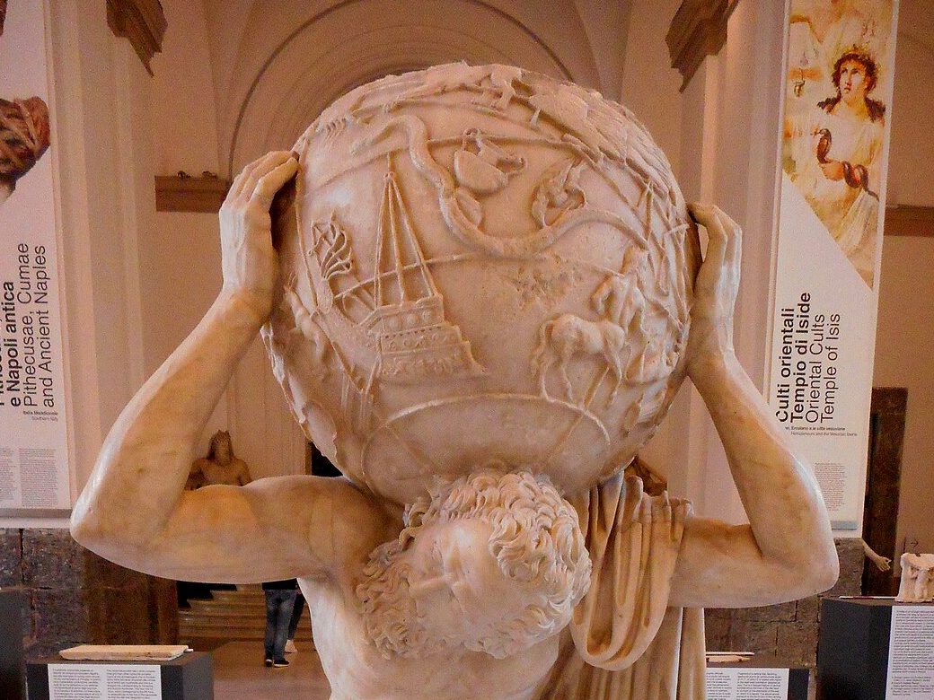The marble Farnese Atlas statue straining to hold an enormous globe on his shoulders.